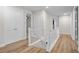 Bright hallway with luxury vinyl plank flooring and neutral paint at 675 Primrose Willow Way, Apopka, FL 32712