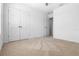 Bright bedroom featuring a closet, neutral carpet, and fresh, white paint at 683 Campo Ln, Davenport, FL 33837
