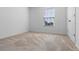 Bedroom with a window and neutral carpet at 683 Campo Ln, Davenport, FL 33837