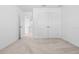 Spare bedroom featuring closet, carpet, and fresh, white paint at 683 Campo Ln, Davenport, FL 33837