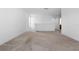 Spacious bonus room featuring neutral carpet and fresh, white paint at 683 Campo Ln, Davenport, FL 33837