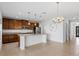 Modern kitchen featuring stainless appliances, granite countertops, and dark wood cabinetry at 683 Campo Ln, Davenport, FL 33837