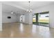 Open-concept living space featuring tile floors and sliding glass doors to the backyard at 683 Campo Ln, Davenport, FL 33837