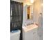 Bathroom featuring a sleek vanity, mirror, and a window with natural lighting at 736 Guy Rd, Orlando, FL 32828