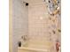 Bathroom featuring a shower and tub combo with neutral tile and bright lighting at 736 Guy Rd, Orlando, FL 32828