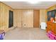 Carpeted bedroom with closet and natural lighting at 736 Guy Rd, Orlando, FL 32828