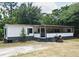 Single-story home featuring a covered porch and an outdoor grill at 736 Guy Rd, Orlando, FL 32828