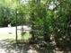 Gate with surrounding greenery and a mailbox nearby, hinting at a private entrance at 736 Guy Rd, Orlando, FL 32828