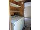 A practical laundry area with modern appliances and convenient access to the bedroom at 736 Guy Rd, Orlando, FL 32828