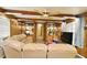 Bright living area with ample seating, built-in shelving, and a ceiling fan at 736 Guy Rd, Orlando, FL 32828