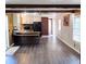 Open floor plan featuring a wet bar that connects the living room and kitchen space at 736 Guy Rd, Orlando, FL 32828