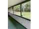 Spacious screened in porch with view of the backyard landscaping at 736 Guy Rd, Orlando, FL 32828