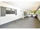 Spacious covered porch with outdoor seating and ample room for activities at 736 Guy Rd, Orlando, FL 32828
