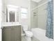 Hall bathroom with vanity and shower-over-tub with shower curtain at 743 Driving Range Ct, Reunion, FL 34747