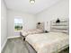 Bright bedroom with carpeted floors, two twin beds, and a window at 743 Driving Range Ct, Reunion, FL 34747