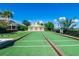 Well-maintained bocce ball court with lush green turf and charming surroundings at 743 Driving Range Ct, Reunion, FL 34747