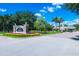 Welcome to Reunion! Gated community entrance with manicured landscaping and beautiful signage at 743 Driving Range Ct, Reunion, FL 34747