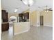 Eat-in kitchen featuring stainless steel appliances, dark wood cabinets and granite countertops at 854 Mendoza Dr, Kissimmee, FL 34758