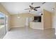Bright and airy living area with tile floors and view of the kitchen bar area at 854 Mendoza Dr, Kissimmee, FL 34758