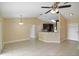 Open-concept living area featuring tile flooring, high ceilings, and an eat-in kitchen bar at 854 Mendoza Dr, Kissimmee, FL 34758