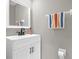 Modern bathroom featuring a vanity with a black faucet, and a white framed mirror at 9112 Grey Moss Dr, Orlando, FL 32832