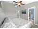 Primary bedroom featuring a ceiling fan and a television at 9112 Grey Moss Dr, Orlando, FL 32832