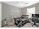Comfortable bedroom with airplane art, a bed, a beanbag chair, and a desk illuminated by natural light at 9112 Grey Moss Dr, Orlando, FL 32832