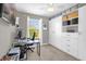 Well-lit bedroom with custom storage, a desk, and a window with bright natural light at 9112 Grey Moss Dr, Orlando, FL 32832