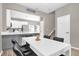 Dining area with modern table and open view to kitchen at 9112 Grey Moss Dr, Orlando, FL 32832