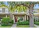Charming townhome with well-manicured landscaping and welcoming front porch at 9112 Grey Moss Dr, Orlando, FL 32832