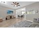 Open-concept living room with wood floors and modern decor at 9112 Grey Moss Dr, Orlando, FL 32832