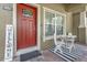 Charming front porch with seating area and modern decor at 9112 Grey Moss Dr, Orlando, FL 32832