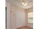 Bedroom closet with white bi-fold doors, a ceiling fan, and a large window at 9681 Lake Douglas Pl, Orlando, FL 32817