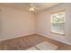 Neutral bedroom with carpet, a ceiling fan, and a bright window at 9681 Lake Douglas Pl, Orlando, FL 32817