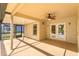 Spacious covered patio with a ceiling fan and access to a screened-in porch at 9681 Lake Douglas Pl, Orlando, FL 32817