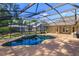 View of screened pool with patio area and connecting doors to the residence at 9681 Lake Douglas Pl, Orlando, FL 32817