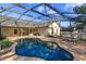 Screened in pool is surrounded by a spacious patio area with chaise lounge seating at 9681 Lake Douglas Pl, Orlando, FL 32817