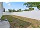 Grassy fenced backyard and patio area at 9919 Cypress Park Dr, Orlando, FL 32824
