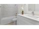 Stylish bathroom featuring a quartz countertop, modern faucet, and tiled shower/tub combo at 9919 Cypress Park Dr, Orlando, FL 32824
