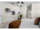 Spacious bedroom features a mirror, a ceiling fan, and ensuite bathroom access at 9919 Cypress Park Dr, Orlando, FL 32824