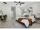 Cozy bedroom featuring modern furnishings, neutral decor, and ensuite bathroom access at 9919 Cypress Park Dr, Orlando, FL 32824