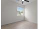 Bright bedroom with neutral tile flooring, ceiling fan, and a window providing natural light at 9919 Cypress Park Dr, Orlando, FL 32824