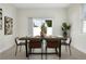 Stylish dining room with a sleek wooden table, comfortable seating, and ample natural light at 9919 Cypress Park Dr, Orlando, FL 32824