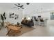 Bright, open-concept living room with modern furnishings, stylish decor, and seamless flow to the kitchen at 9919 Cypress Park Dr, Orlando, FL 32824