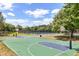 Community basketball court with well-maintained grounds and clear skies at 10166 Hidden Dunes Ln, Orlando, FL 32832