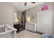 Bedroom features neutral walls, wood floors, dresser, and a closet at 10166 Hidden Dunes Ln, Orlando, FL 32832