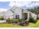 Lovely single-story home boasting a well-manicured lawn and inviting front entrance at 10166 Hidden Dunes Ln, Orlando, FL 32832