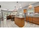 Bright and airy kitchen seamlessly connects to the dining and living spaces at 10166 Hidden Dunes Ln, Orlando, FL 32832