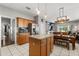 Open-concept kitchen flowing into the dining area, great for entertaining at 10166 Hidden Dunes Ln, Orlando, FL 32832