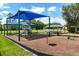 Well-equipped playground with slides, swings, and covered seating areas for Gathering fun at 10166 Hidden Dunes Ln, Orlando, FL 32832